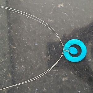 Necklace with enamel turquoise colour circle